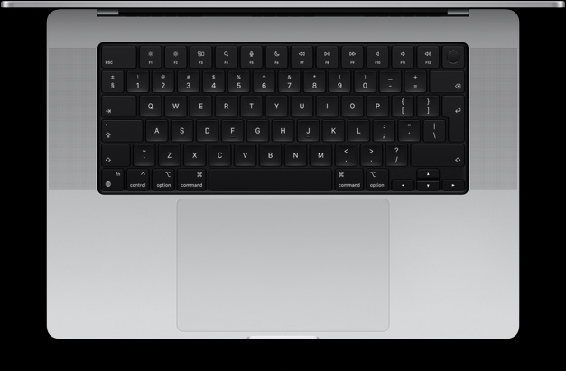 Top-down view of open MacBook Pro 16-inch showing Force Touch trackpad located below keyboard