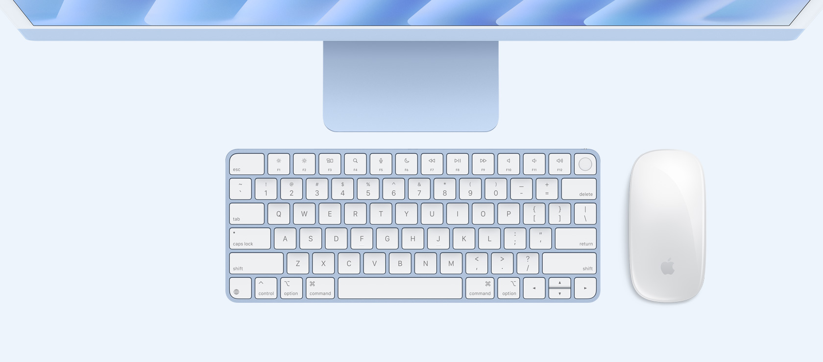 Overhead view of a blue iMac with colour-matching mouse and keyboard