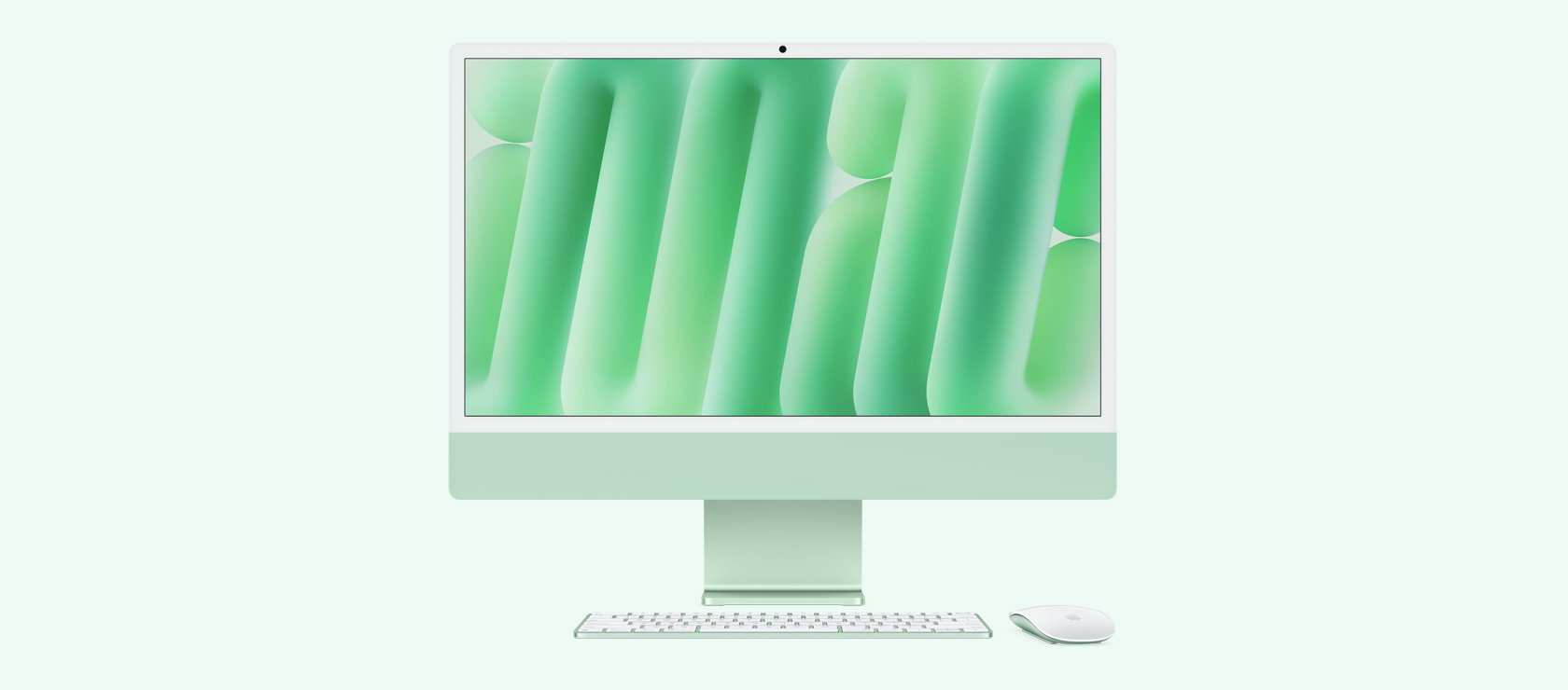 Front view of a green iMac with colour-matching mouse and keyboard