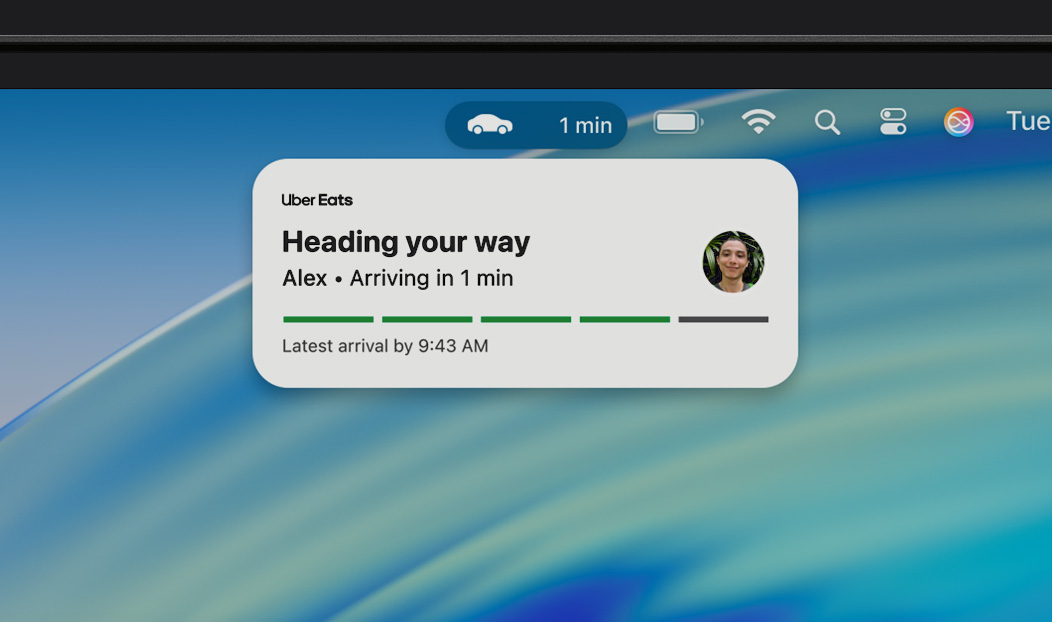 MacBook Pro, Live Activity notification shows an Uber Eats is on the way